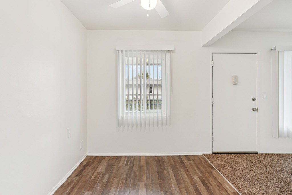 A room with a window and a door.