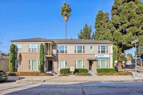 A building with a blue sign on the front.