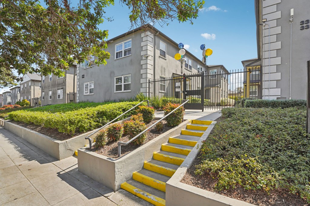 A set of yellow steps lead up to a building.