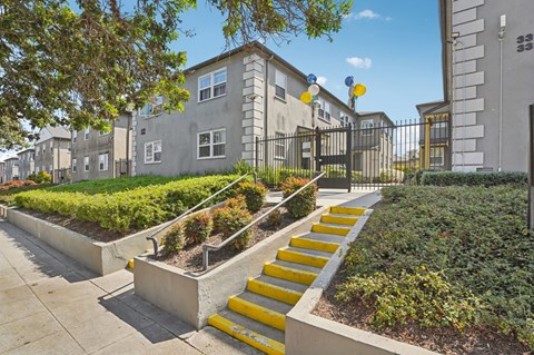 A set of yellow steps lead up to a building.