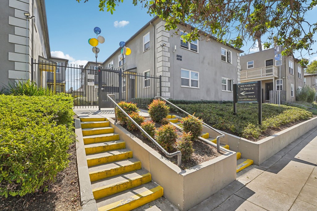 A set of yellow steps lead up to a building entrance.