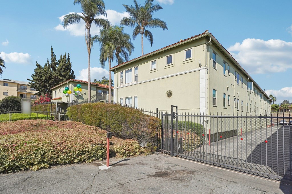 A building with a black gate in front of it.