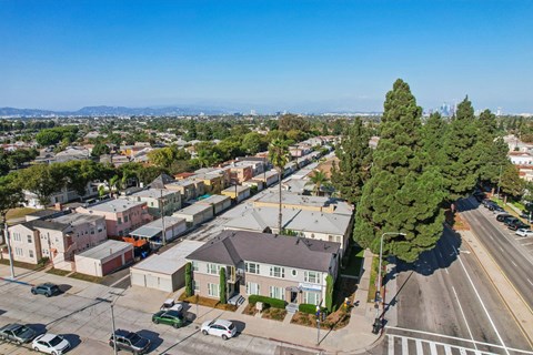 A residential area with houses and parked cars.