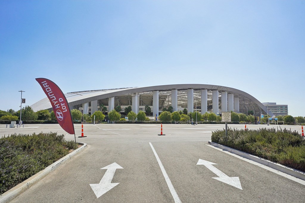 A large building with a red banner that says "ENTRANCE" in front of it.