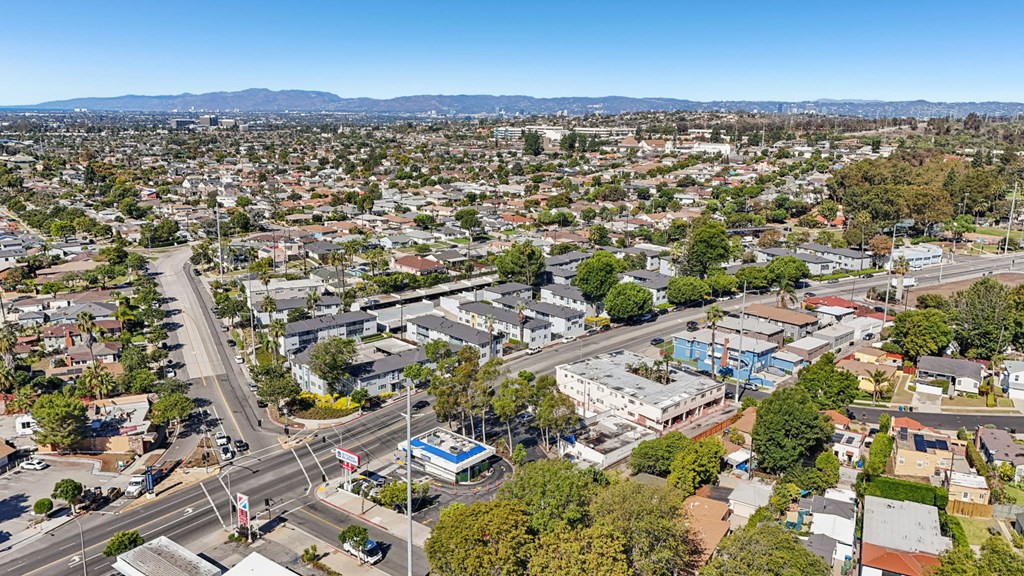 A cityscape with a clear blue sky above.
