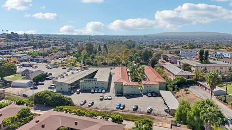 A large building with a parking lot in front of it.