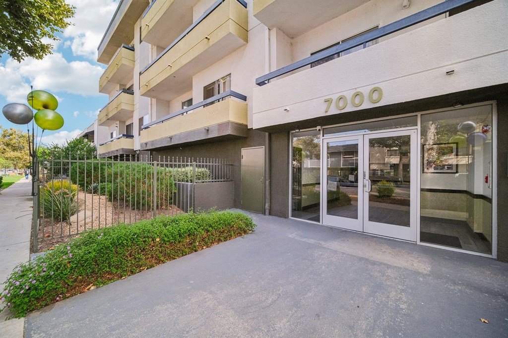 The image shows the front of a building with the number 7000 on it.