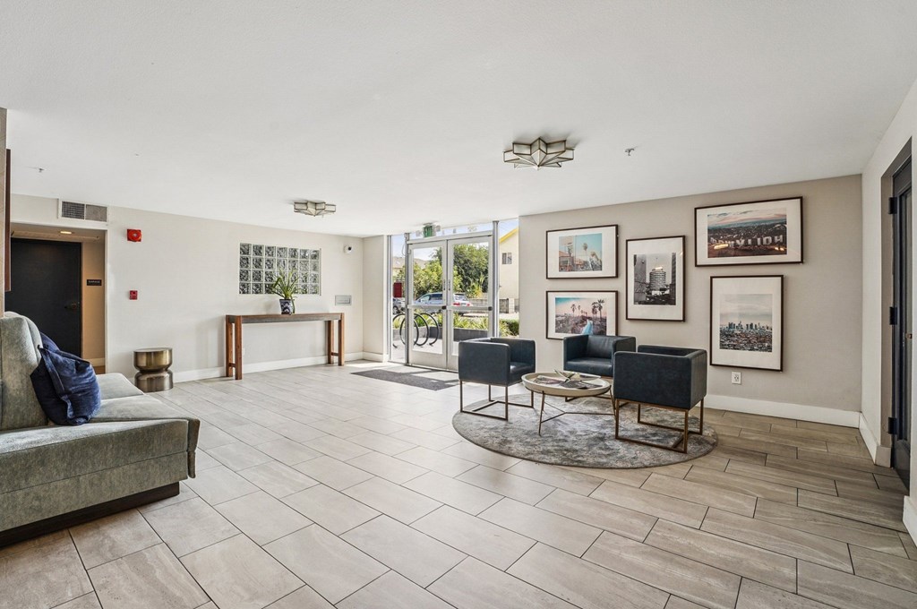 A living room with a grey couch and a coffee table.