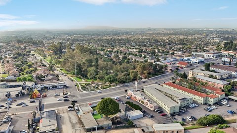 A cityscape with buildings, roads, and vehicles.