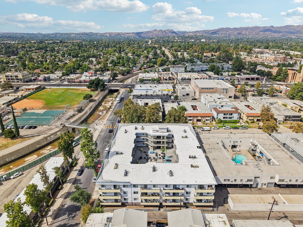 A large building with a pool in the middle of it.