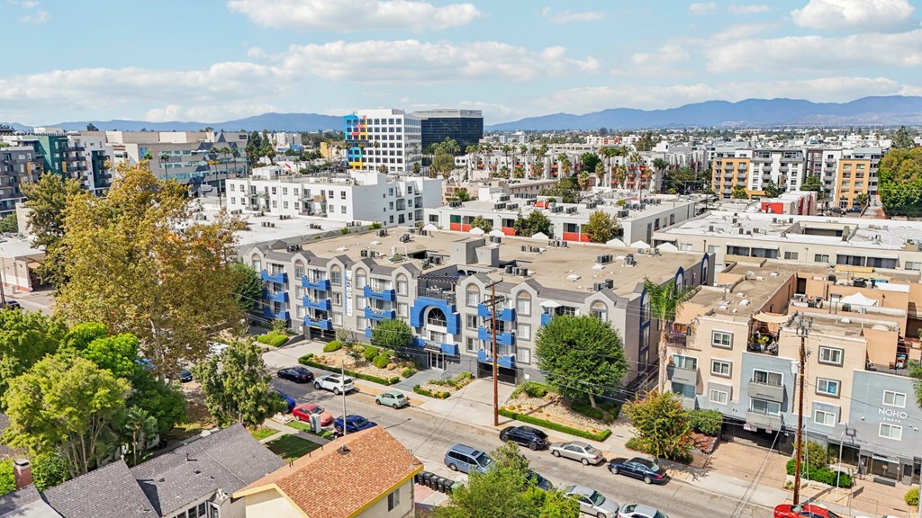 A cityscape with buildings and cars.
