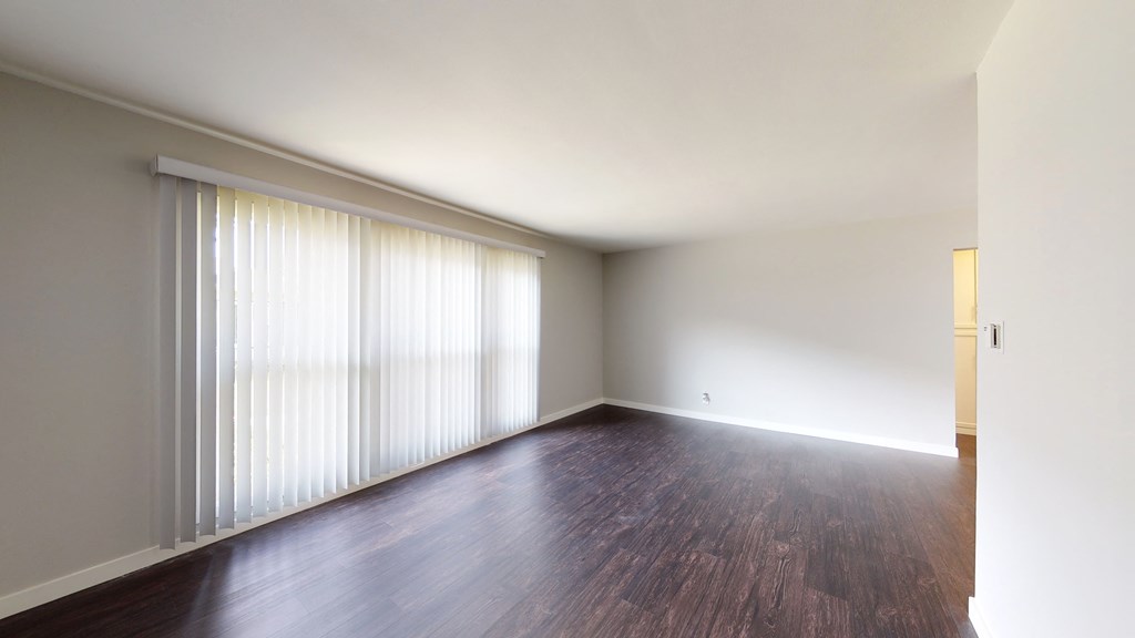 Hollypark Knolls Living room with large windows.