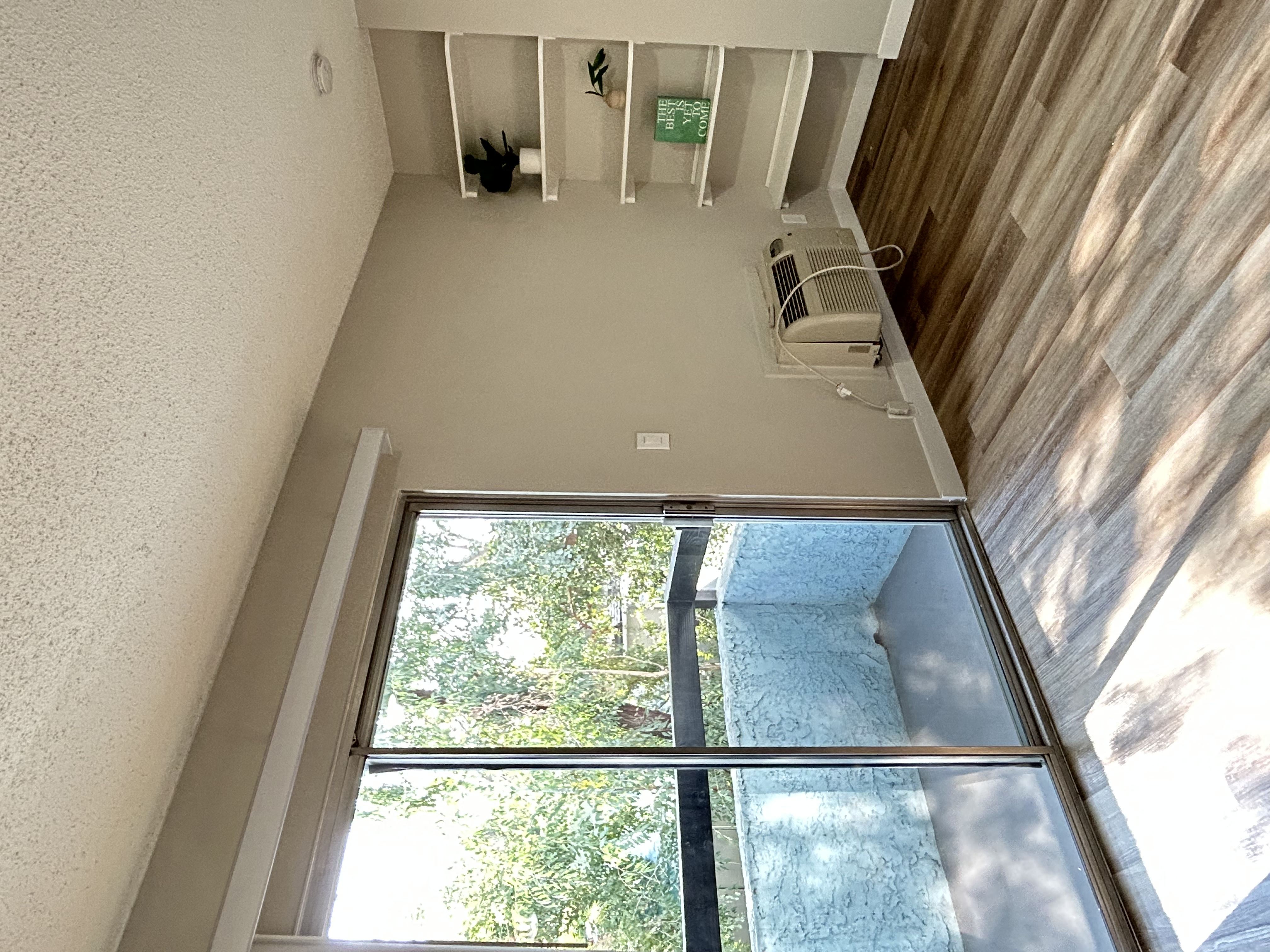 an overhead view of a room with a large glass window