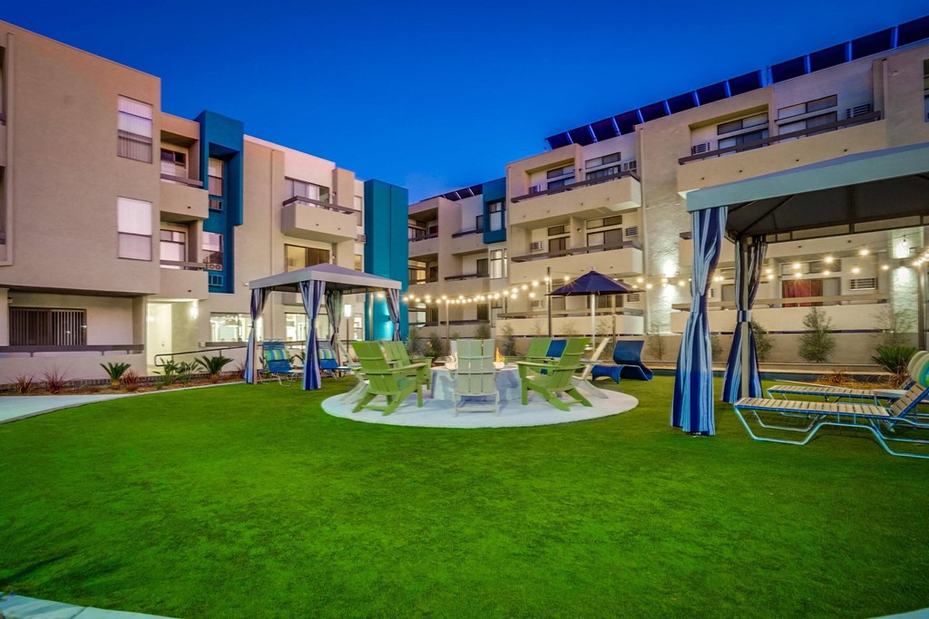 a rendering of a patio with chairs and tables in an apartment building