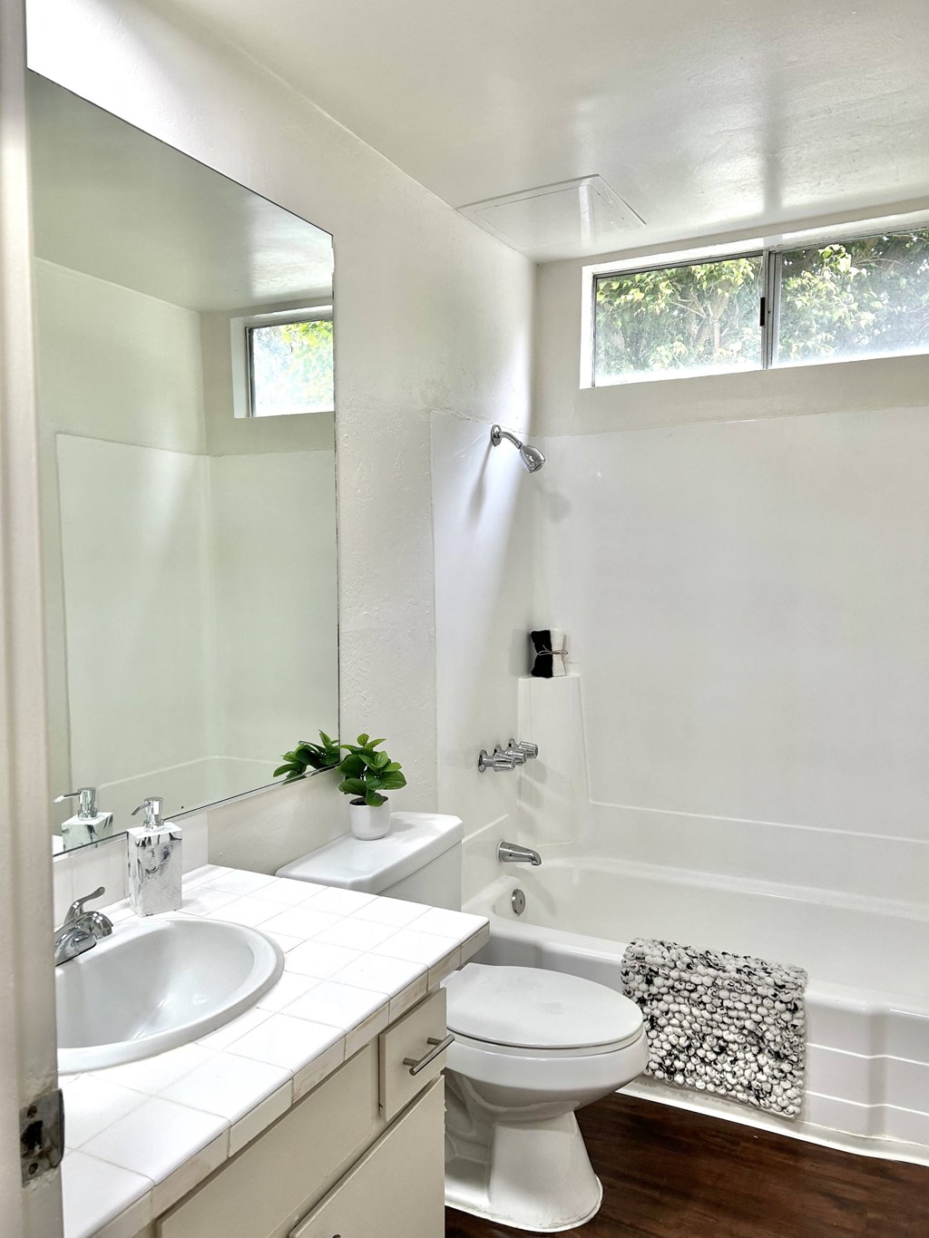 a small bathroom with a toilet sink and shower