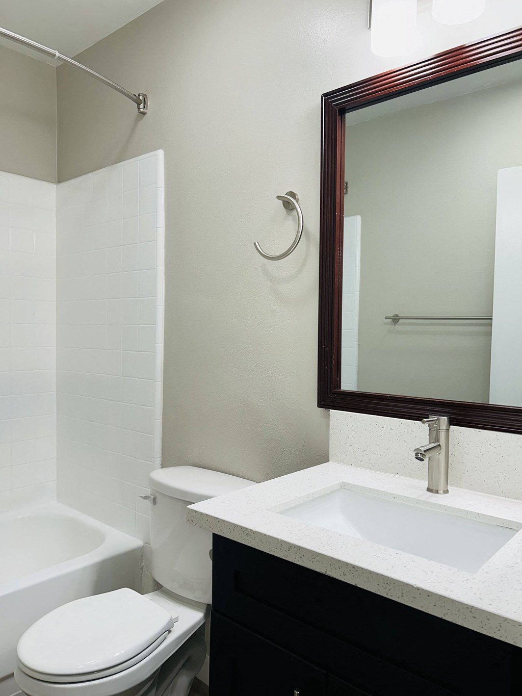 a bathroom with a toilet and a sink and a mirror