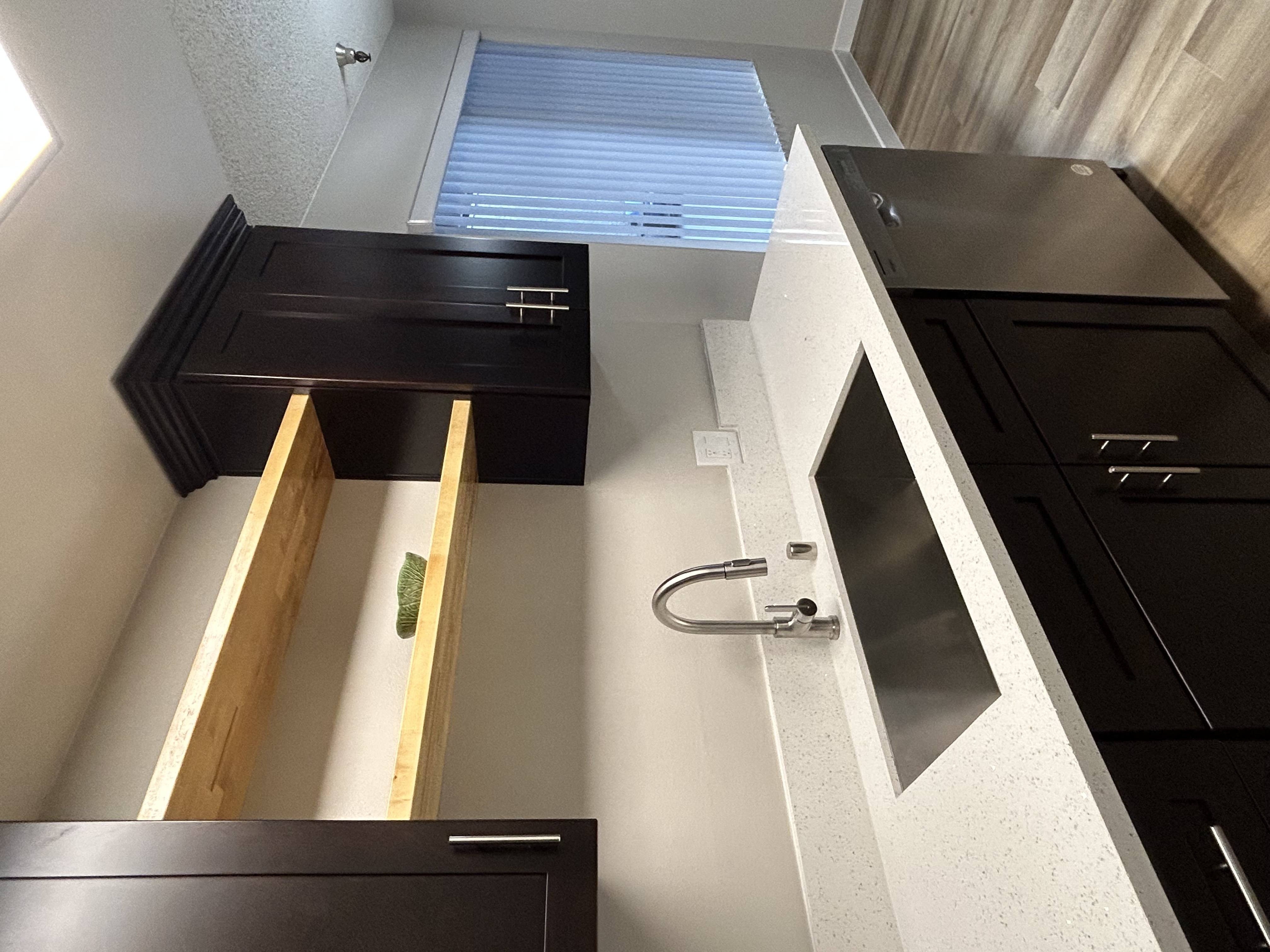 a view from above of a kitchen with a sink and a window