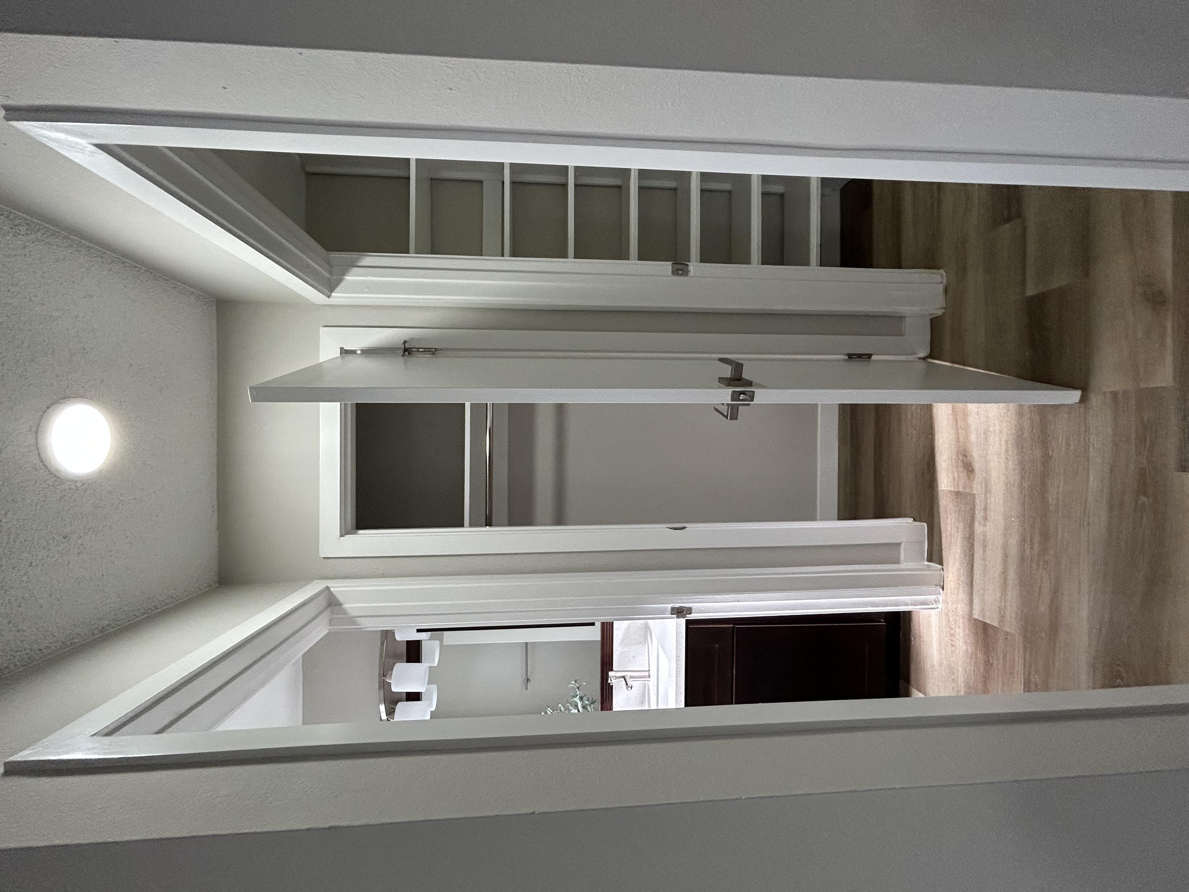 a kitchen with a sink and a mirror