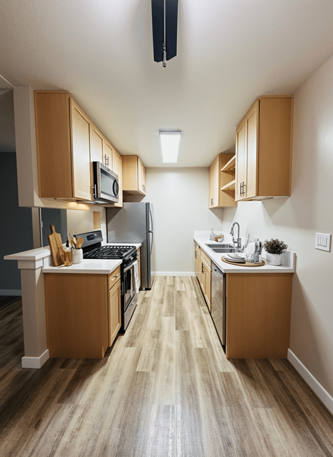 A kitchen with wooden cabinets and a white counter.