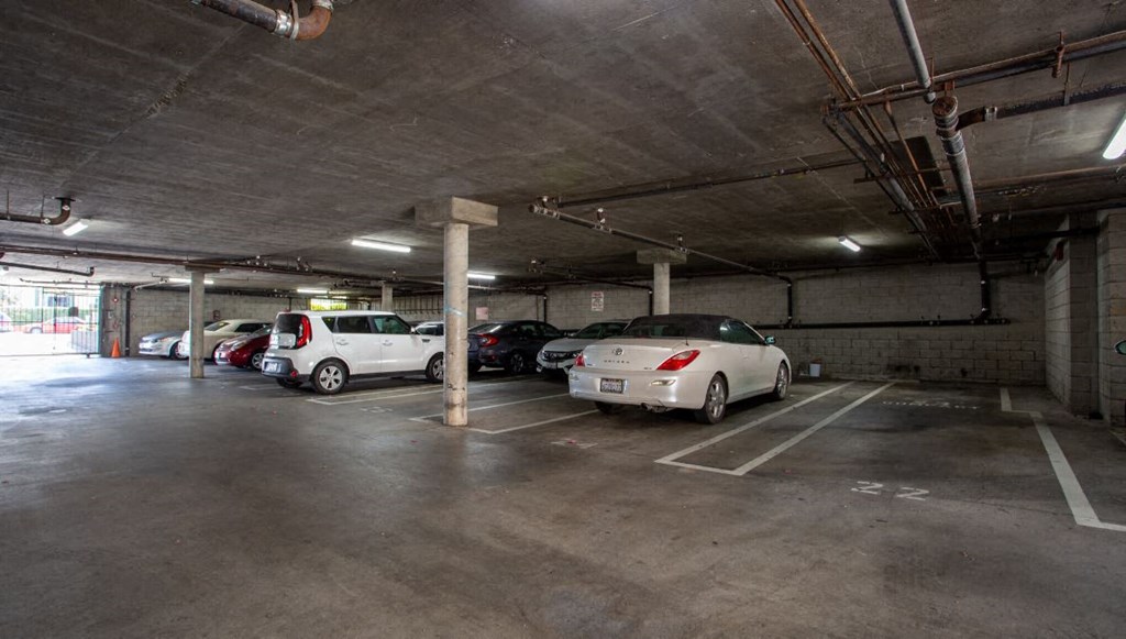 a parking garage with cars parked in it