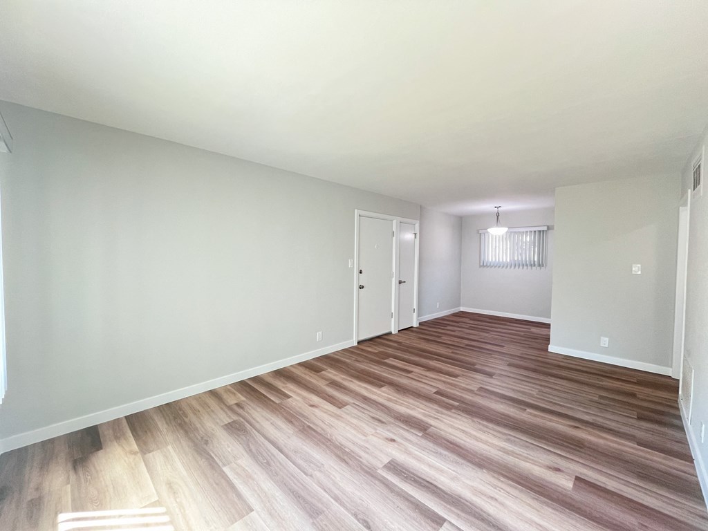 an empty room with a clock on the wall