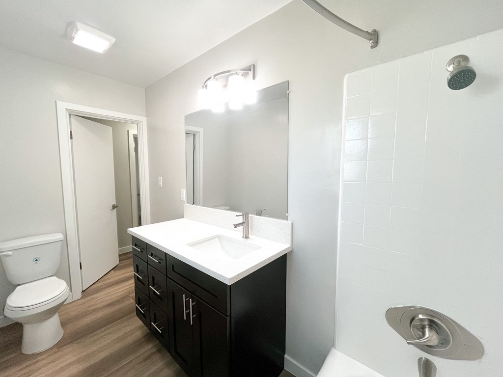 an empty bathroom with a sink and a toilet