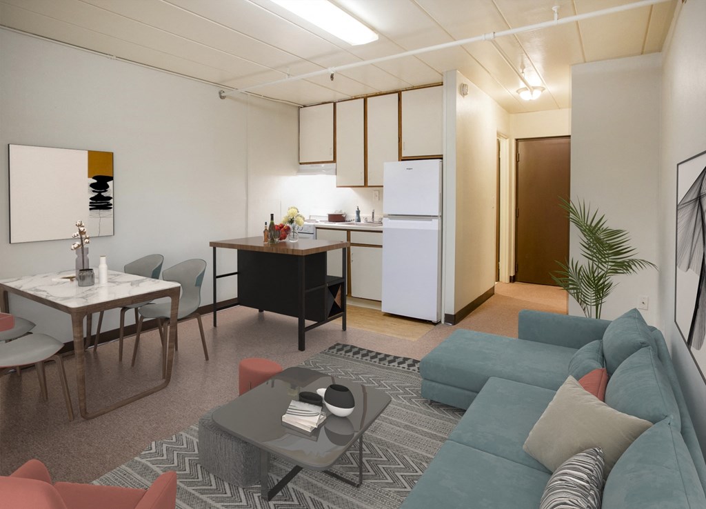 A living room with a couch, chairs, and a coffee table.