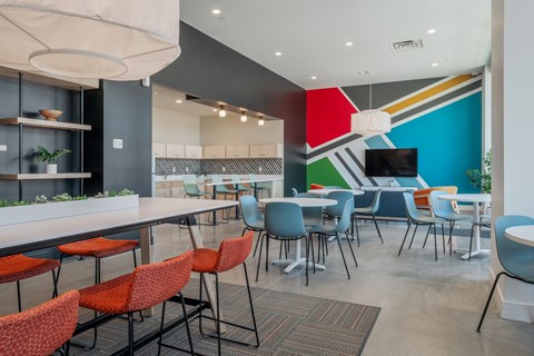 A modern dining area with a long table and chairs.