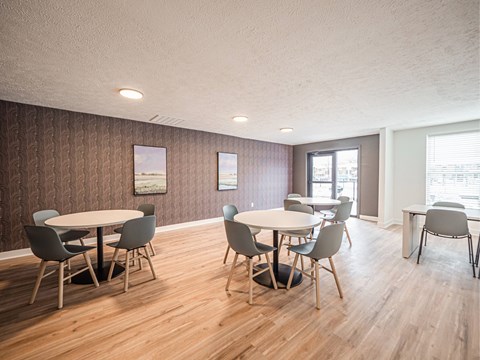 A conference room with a long table and chairs.