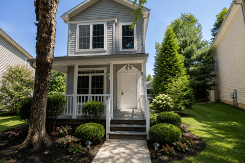 A house with a white door and a porch.