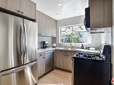 a kitchen with a stove and a refrigerator