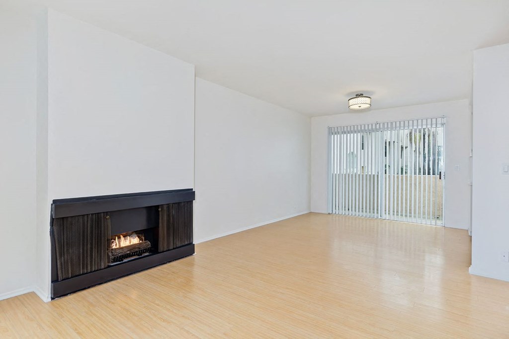 Living room with fireplace centered in the largest wide angle wall