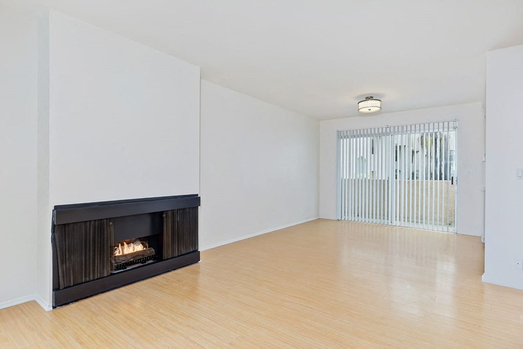 Fireplace next to dining room and balcony sliding glass door