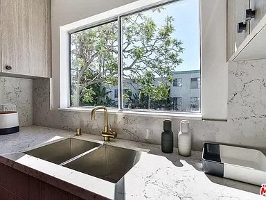 a kitchen with a sink and a window