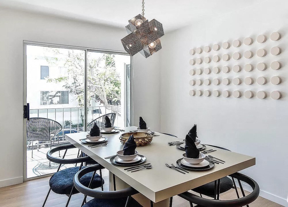 a dining room with a table and chairs