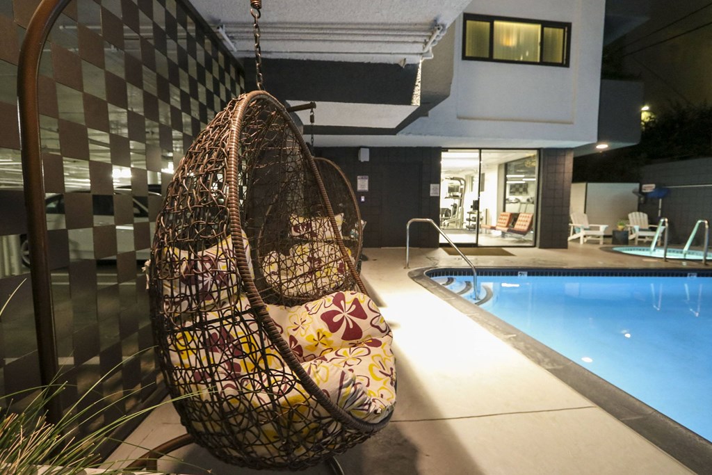 Pool side relaxing chair at Westwood Riviera Apartments, California, 90024