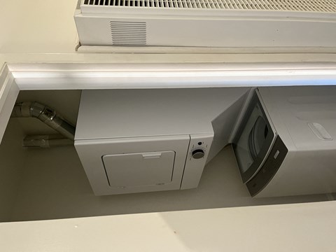 a printer and a monitor on a desk