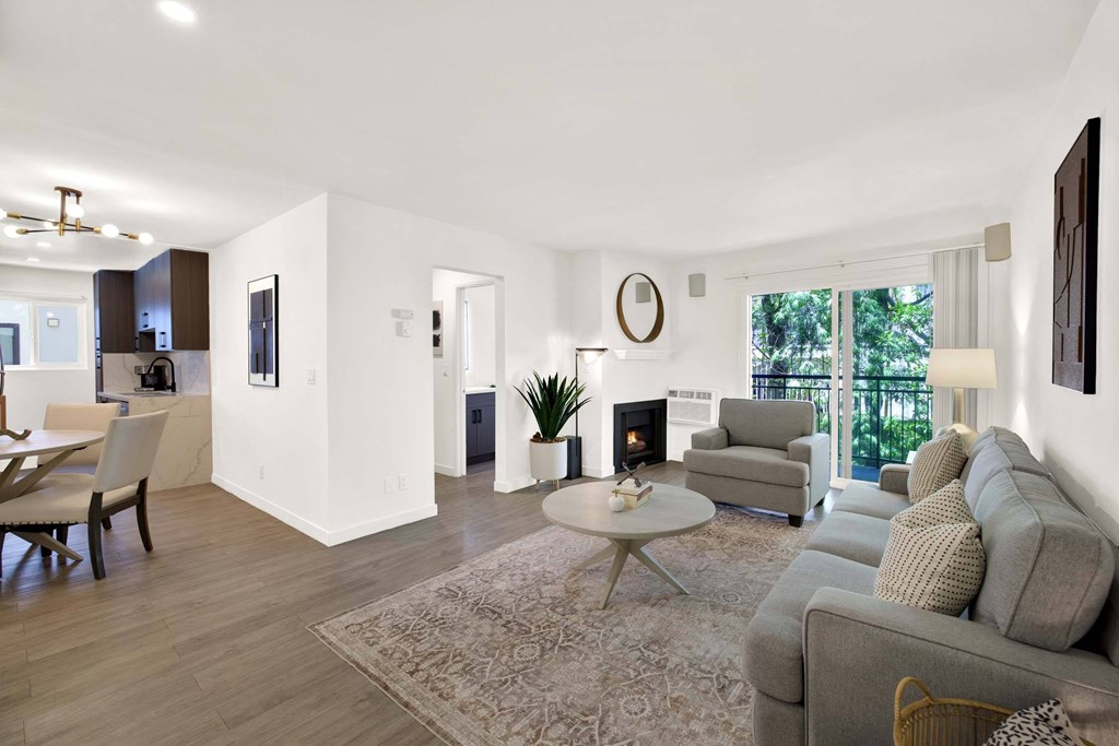 A modern living room with a grey sofa and a coffee table.