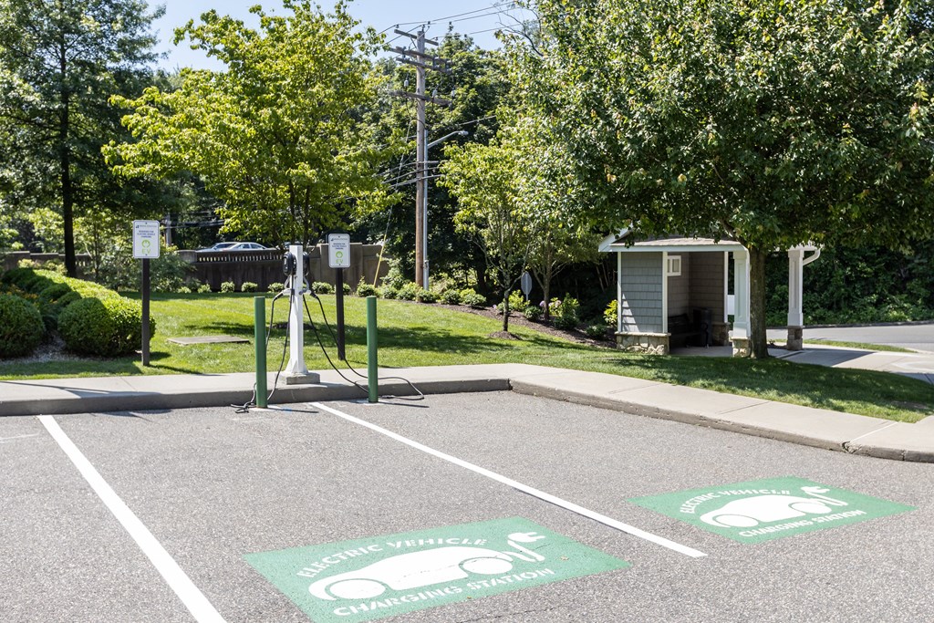 A parking lot with two electric vehicle charging stations.