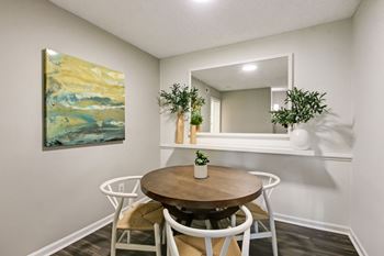 a dining room with a table and chairs and a mirror at Timberwalk at Mandarin Apartment Homes, Florida, 32257