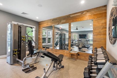 the gym has plenty of equipment including treadmills and weights at Barclay Chase Apartment Homes, Marlton