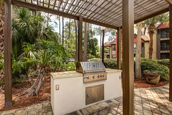 a covered patio with a gas grill at Timberwalk at Mandarin Apartment Homes, Florida, 32257
