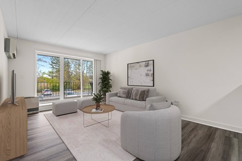 A living room with a grey sofa and a coffee table.