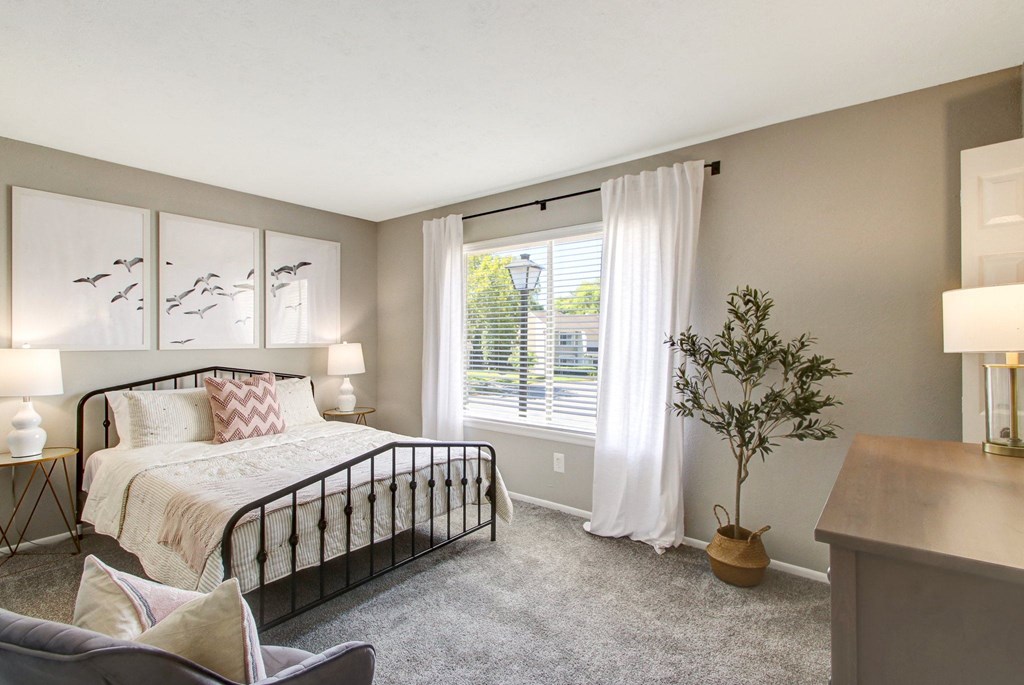 Bedroom with cozy bed at The Fountains at Deerwood Apartments, Jacksonville, FL, 32256
