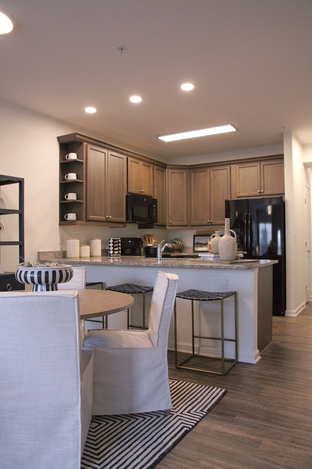 a view of a kitchen and a living room with a table and chairs  at Carillon Woods, Delaware