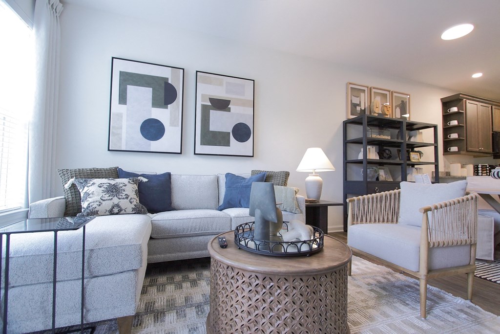 a living room with couches and chairs and a table  at Carillon Woods, Delaware
