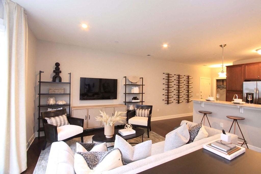 A living room with a couch and two chairs  at Barclay Glen Apartments, New Jersey
