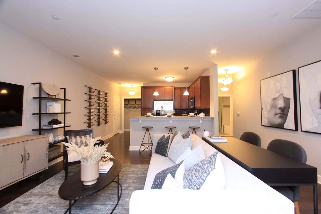 A living room with a kitchen in the background  at Barclay Glen Apartments, Williamstown