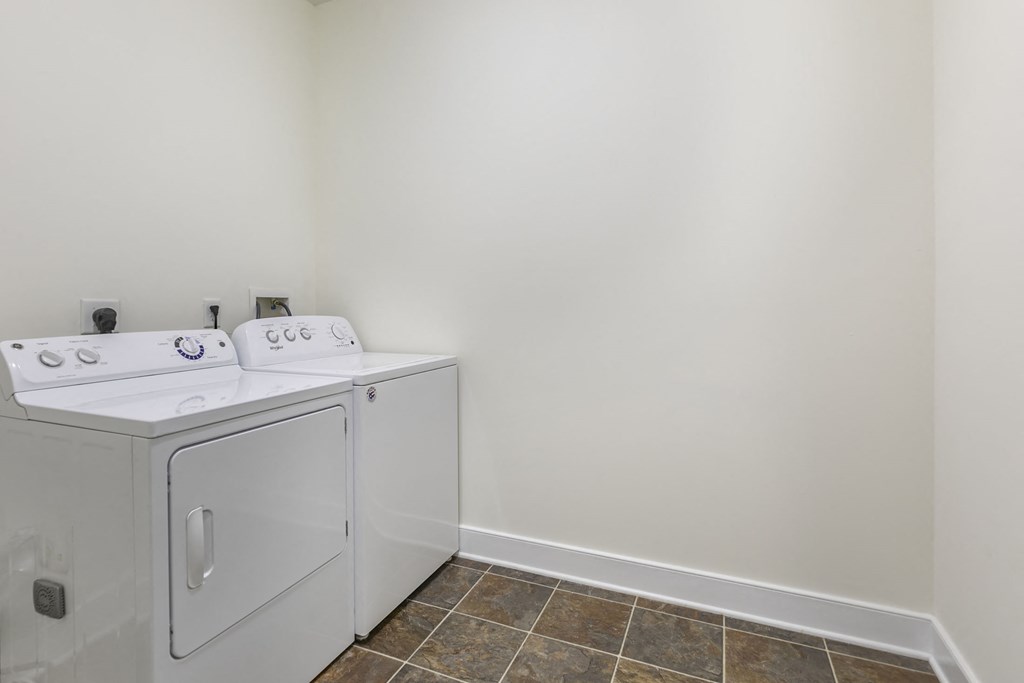 a washer and dryer in a laundry room in The Collings  at The Collings at the Lumberyard, Collingswood