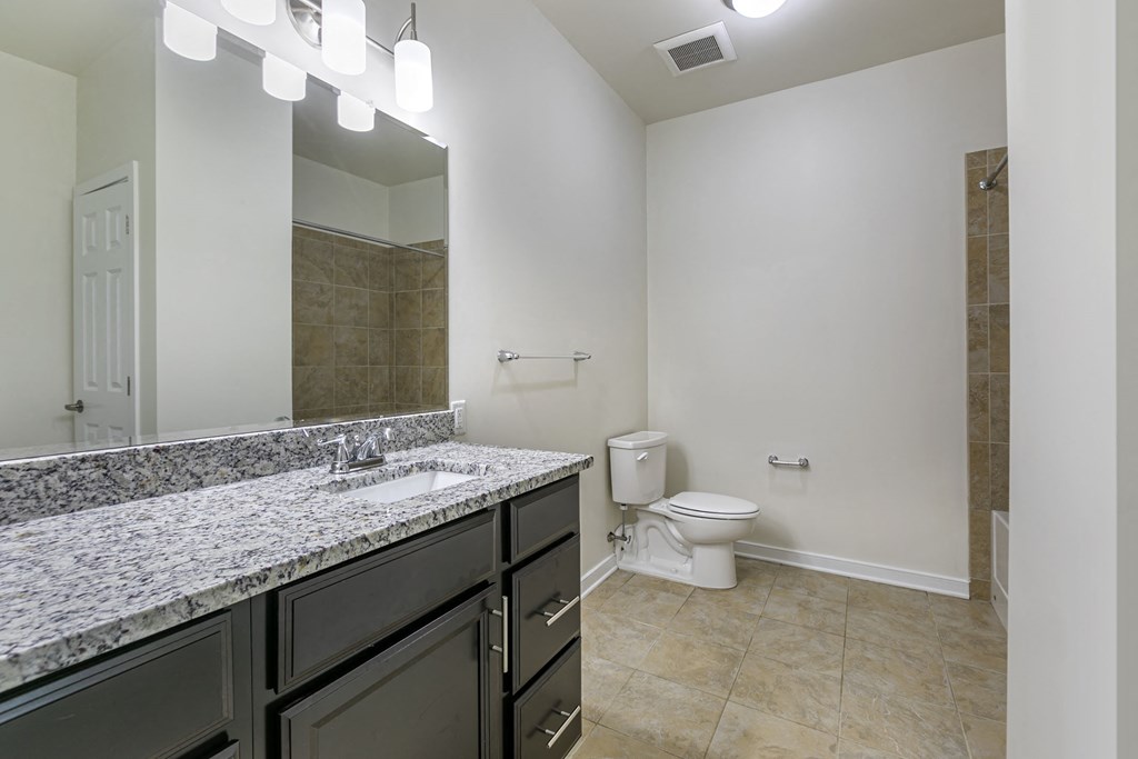 a bathroom with a sink, toilet and mirror in The Collings  at The Collings at the Lumberyard, New Jersey, 08108
